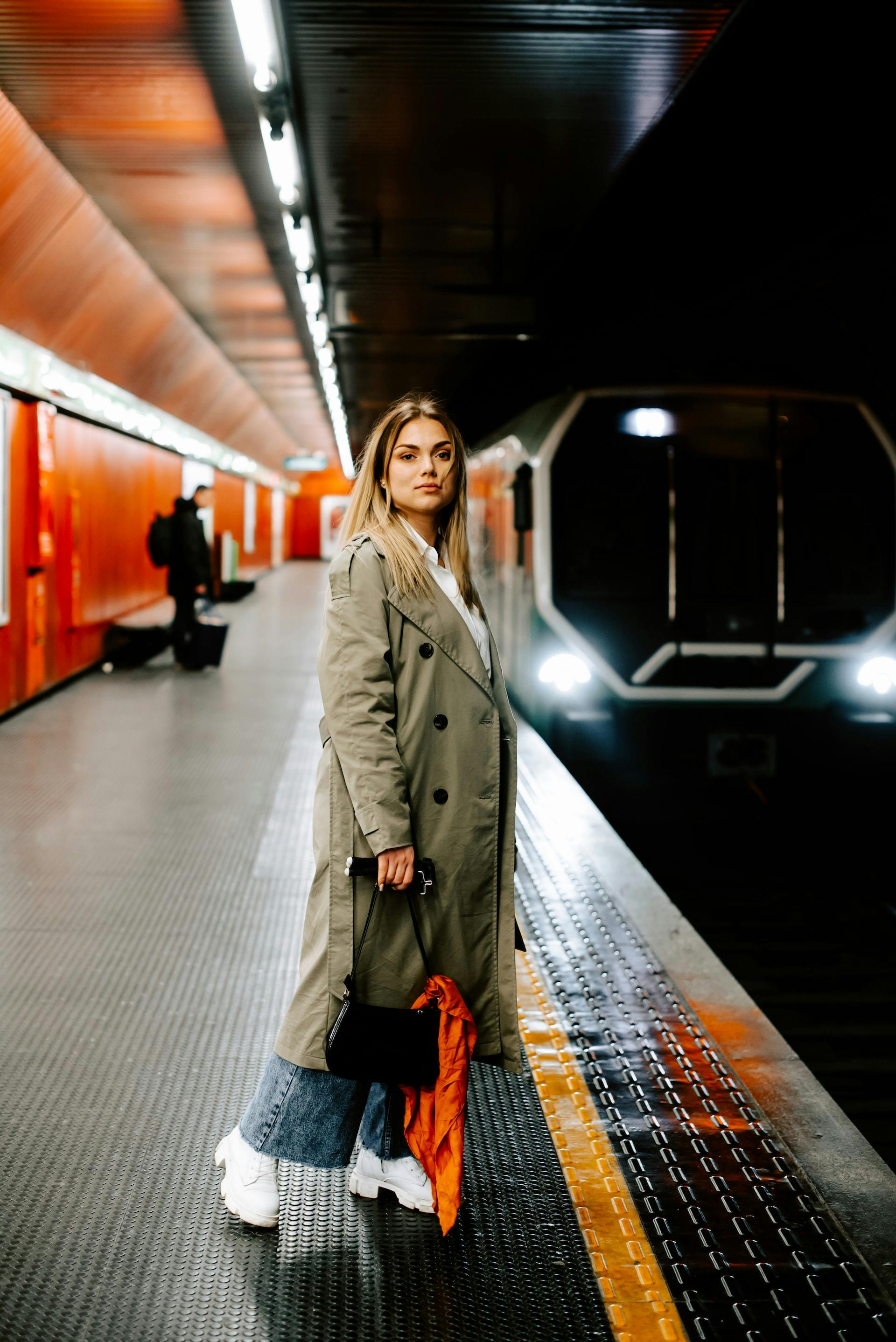 A girl posing for a photo shoot in a station